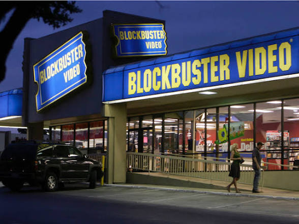 Blockbuster Video storefront lit up at dusk