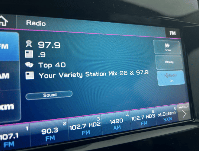 Car radio display showing RDS station data